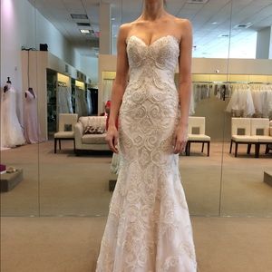 Beaded lace fit and flare wedding gown. Worn once and dry cleaned.